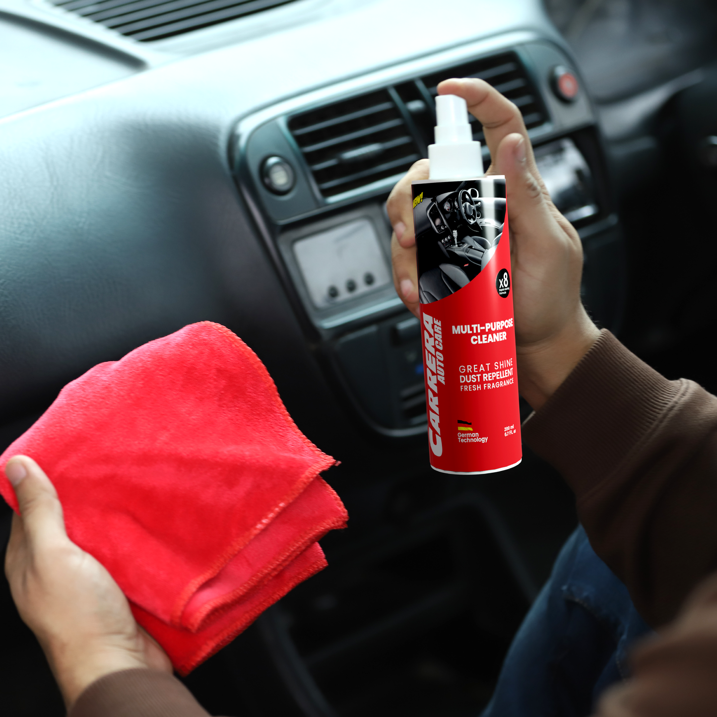 a man cleaning his car Dashboard with towel